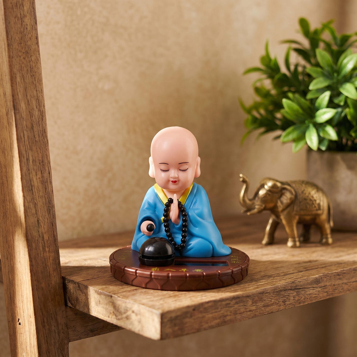 Solar Praying Monk Statue in blue robe